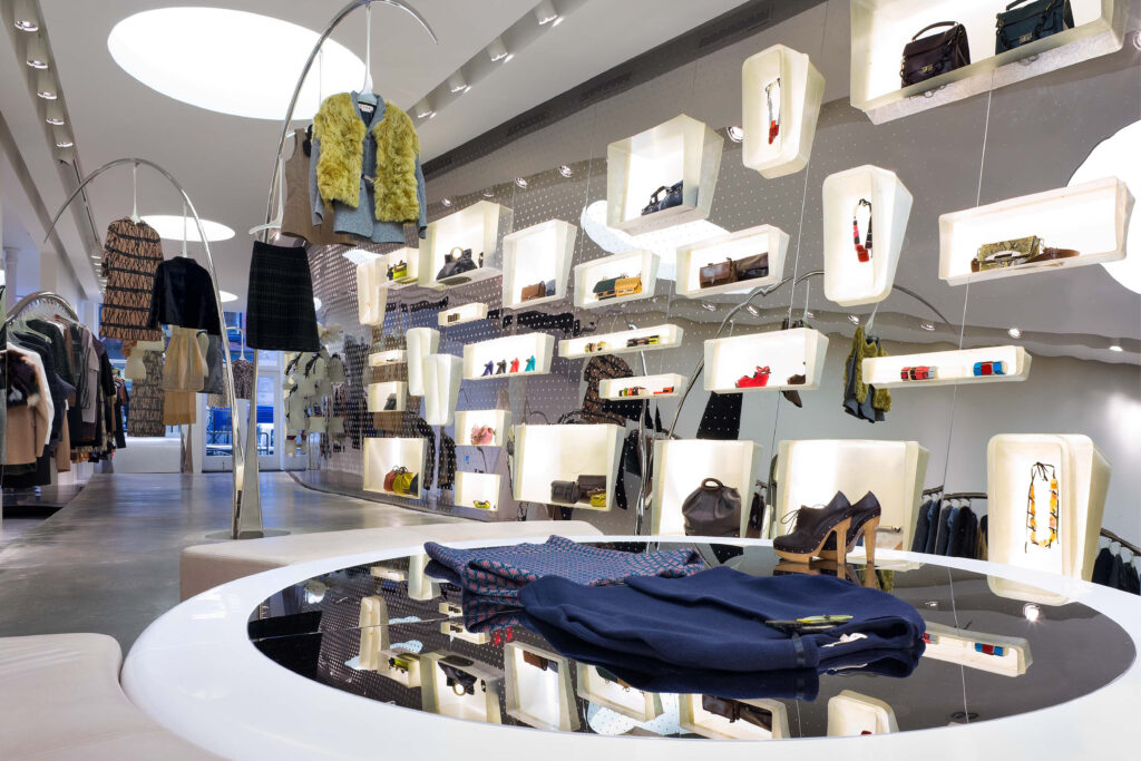 Marni Mercer Street boutique in New York featuring polished chrome furniture, red accents, and avant-garde interior design by Sybarite.