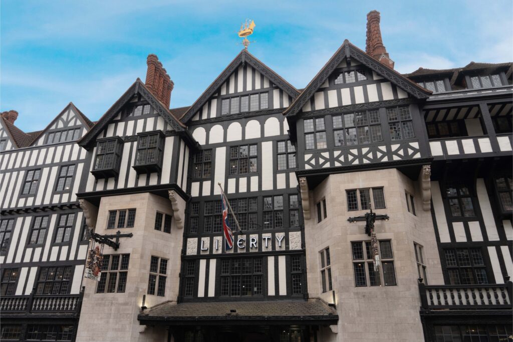 Exterior of Liberty London, the iconic Tudor-style department store featuring timber-framed architecture.