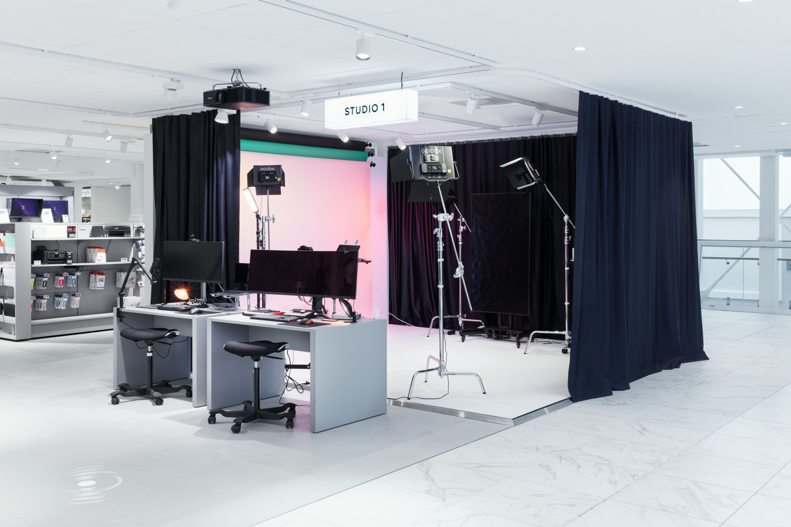 Modern in-store photo and content creation studio at Steen & Strøm, featuring lighting equipment and digital workstations — showcasing timeless retail design principles in experiential retail.